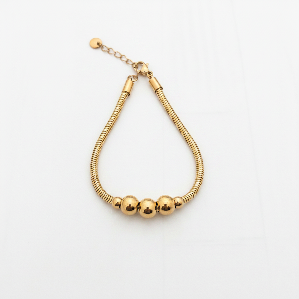 Bracelet serpent doré perles - fond blanc